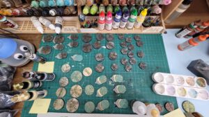 All kinds of Necromunda bases, painted in metalic paints
